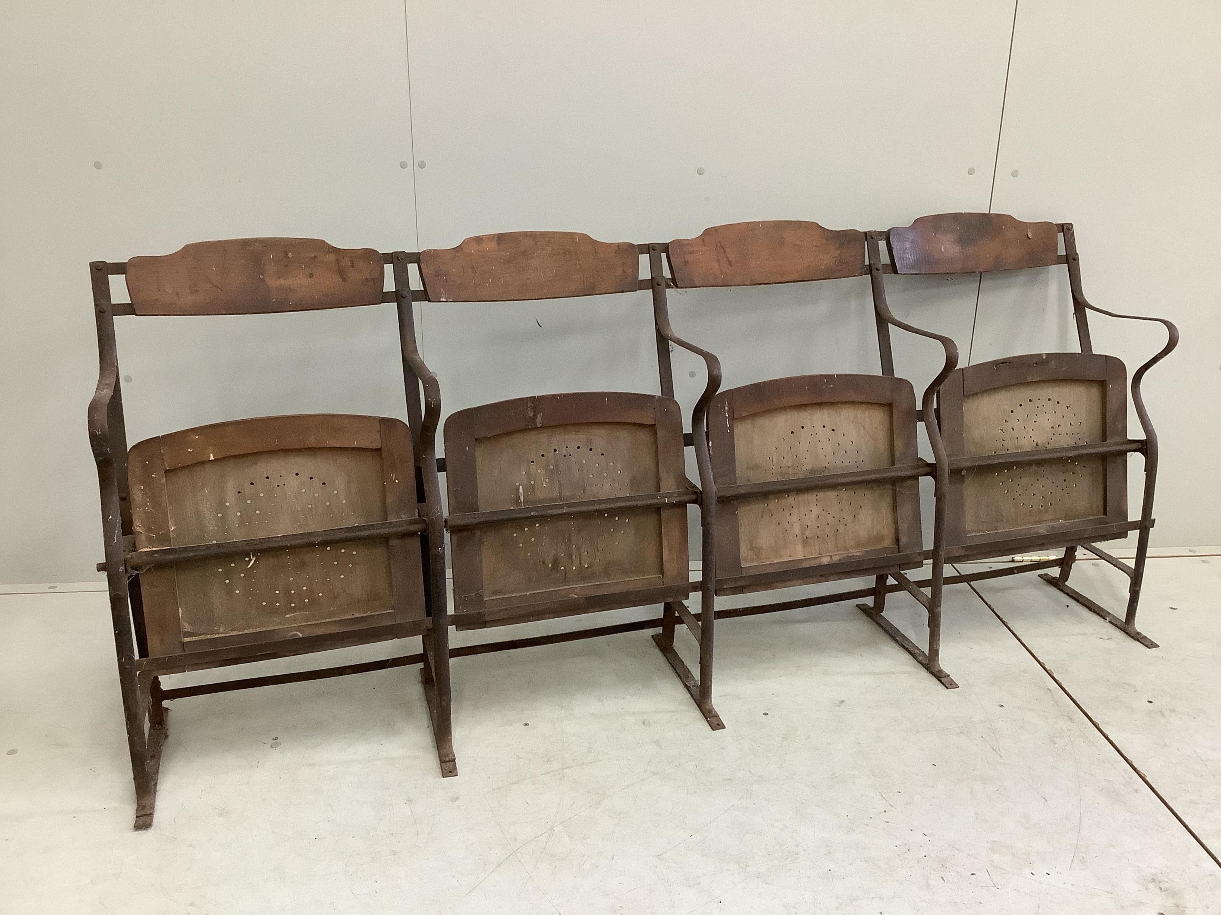 Three vintage French wrought iron and beech folding cinema seat rows, each width 193cm, height 84cm. Condition - poor